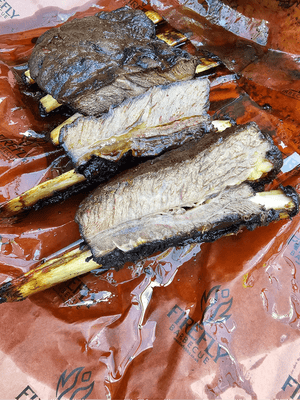 Smoked beef ribs on Oren Pink Butcher Paper BBQ - 61cm x 305m roll, showcasing juicy texture and bark preservation.