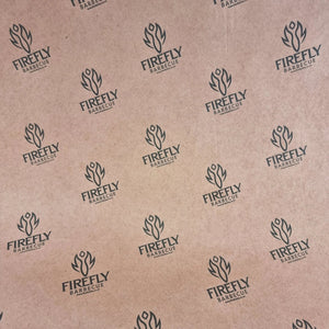 Close-up of Oren Pink Butcher Paper BBQ - 61cm x 305m roll with Firefly BBQ logo, ideal for professional and home BBQ use.