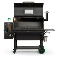 Open Green Mountain Grills PEAK Prime pellet grill showing spacious cooking area, pellet hopper, and Wi-Fi smart control panel.