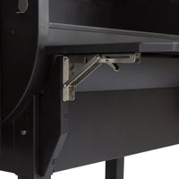 Collapsible front shelf mechanism on GMG PEAK Prime pellet grill, enhancing workspace and storage for outdoor cooking.