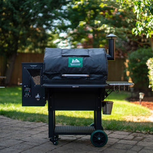 GMG Thermal Blanket - FireFly Barbecue on a Green Mountain Grill in a garden, enhancing grill performance in cold weather.