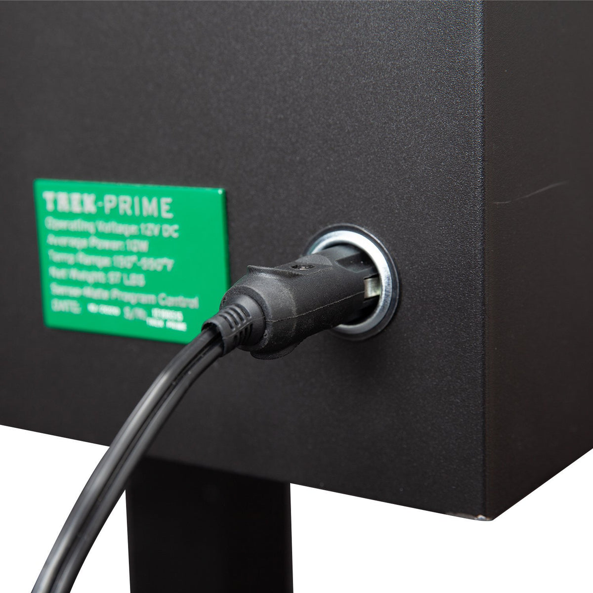 Power input port of GMG Trek Portable BBQ Grill - FireFly Barbecue with 12V DC connection for versatile outdoor use.