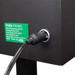 Power input port of GMG Trek Portable BBQ Grill - FireFly Barbecue with 12V DC connection for versatile outdoor use.