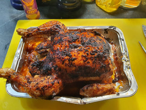 Whole roasted chicken coated in Kansas BBQ Rub - Sweet & Smoky in a foil tray. Juicy and flavorful BBQ result with crispy skin.