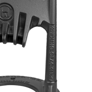Close-up of Kindling Cracker Original blade and logo, emphasizing its sturdy cast iron construction for safe wood splitting.
