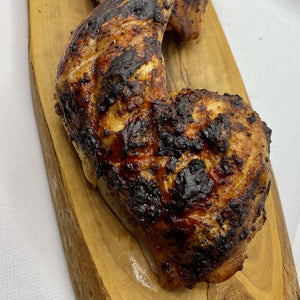 Close-up of grilled chicken seasoned with Cajun rub