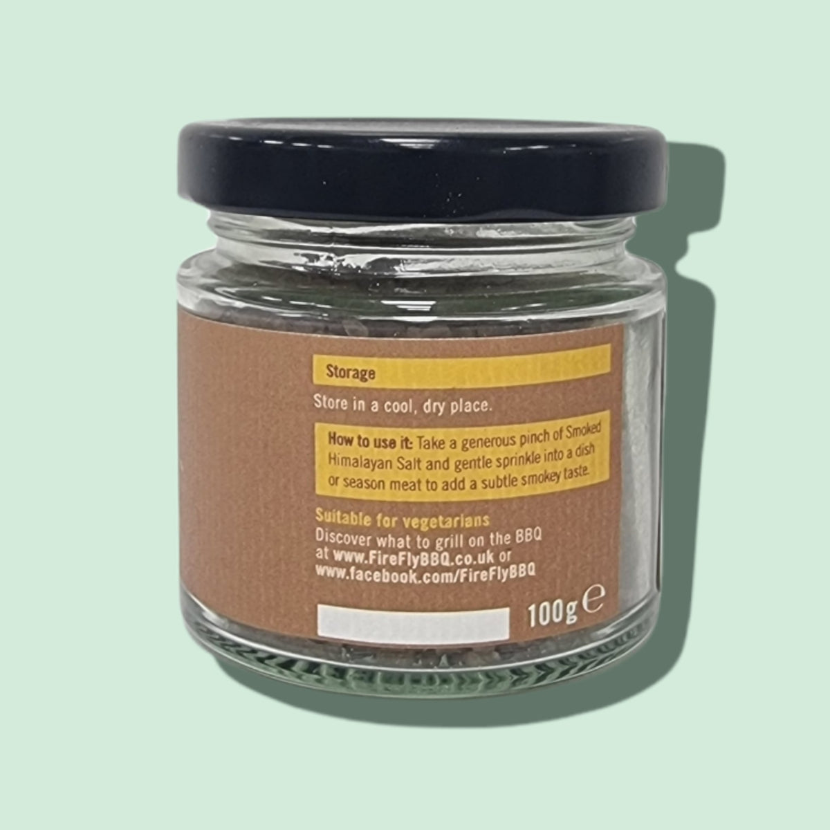 Black lid on glass jar of smoked Himalayan salt