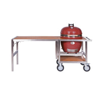 Red ceramic Kamado-style grill on outdoor kitchen cart with teak surface