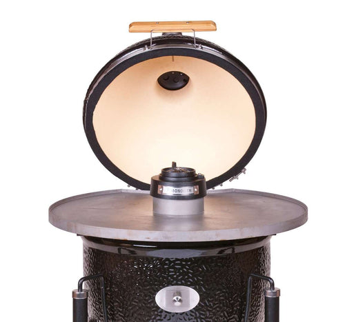 Monolith Fire Plate - LeCHEF mounted on open Monolith grill, showcasing 5 mm steel plate with central ventilation cap for outdoor cooking.