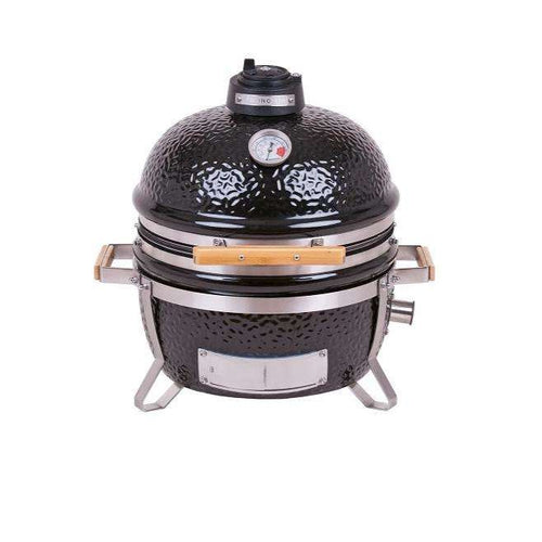 MONOLITH Icon Portable Kamado Grill with black ceramic dome, built-in thermometer, and wooden side handles for compact outdoor cooking.