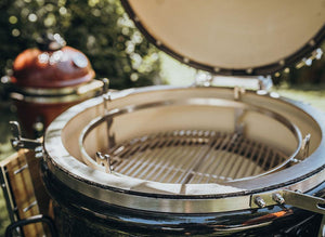 Kamado grill with built-in temperature gauge and ceramic interior