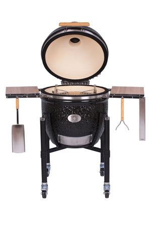 Open Monolith Le Chef Pro Series 2.0 Kamado Grill displaying ceramic interior and stainless steel grill grates, ready for outdoor barbecue use.