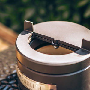 Close-up of Monolith Le Chef Pro Series 2.0 Kamado Grill top vent with precision airflow control for smoking and grilling.