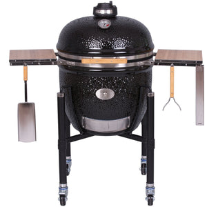 Monolith Le Chef Pro Series 2.0 Kamado Grill with accessories including side tables, spatula, and fork, perfect for versatile grilling.
