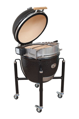 Side view of Monolith LeChef Rotisserie setup on kamado grill, showing robust stainless steel construction