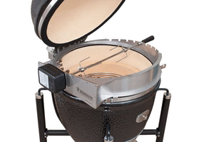 Close-up of Monolith LeChef Rotisserie with spit rod inside kamado grill, highlighting wedge-shaped design