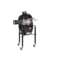 Black ceramic outdoor rotisserie with lid open and cooking surface
