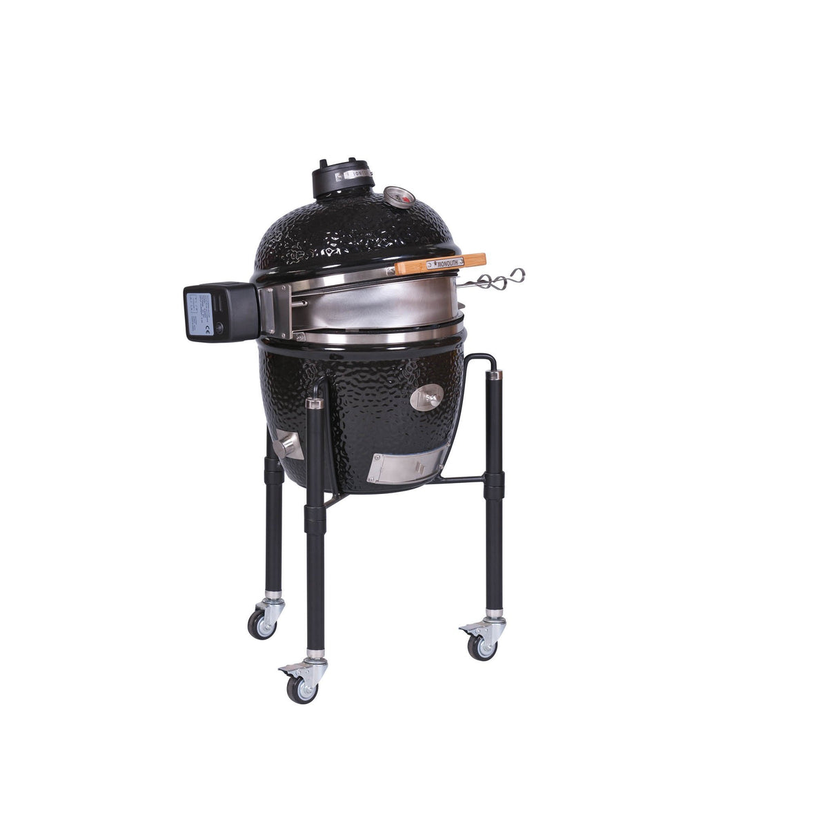 Black ceramic outdoor rotisserie with lid open and cooking surface