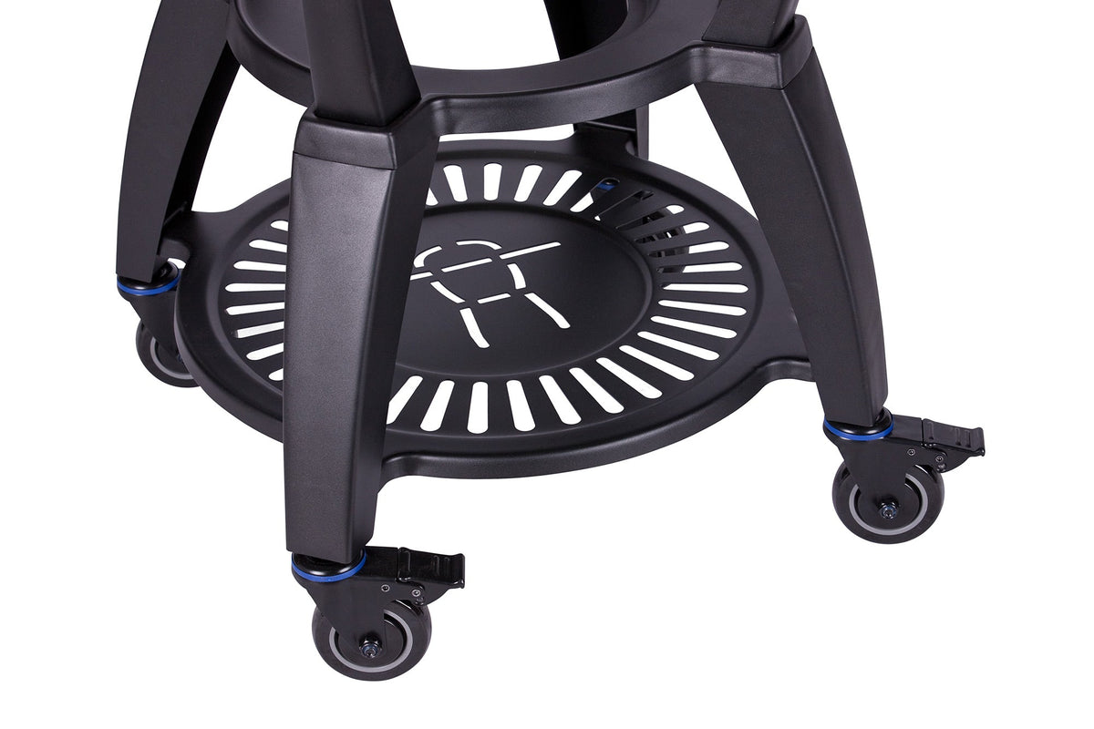 Close-up of black grill surface with logo and ventilation design