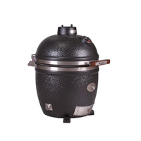 Person handling Monolith Avantgarde Kamado Grill with grilling rack inside