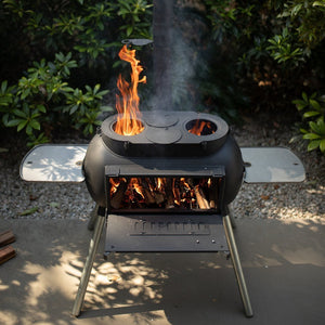Top view of Ozpig Big Pig outdoor stove with dual cooking plates and visible flames, perfect for backyard grilling.