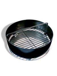 Charcoal basket with attached Pit Barrel Ash Catcher, ideal for simplifying ash removal in outdoor cooking setups.