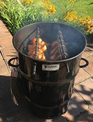 Pit Barrel Classic Cooker Standard loaded with seasoned chicken on hanging rods, perfect for outdoor barbecue enthusiasts.