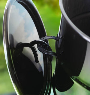 Close-up of Pit Barrel Classic Cooker Standard lid hook design, showing convenient horseshoe-style lid holder for easy access.