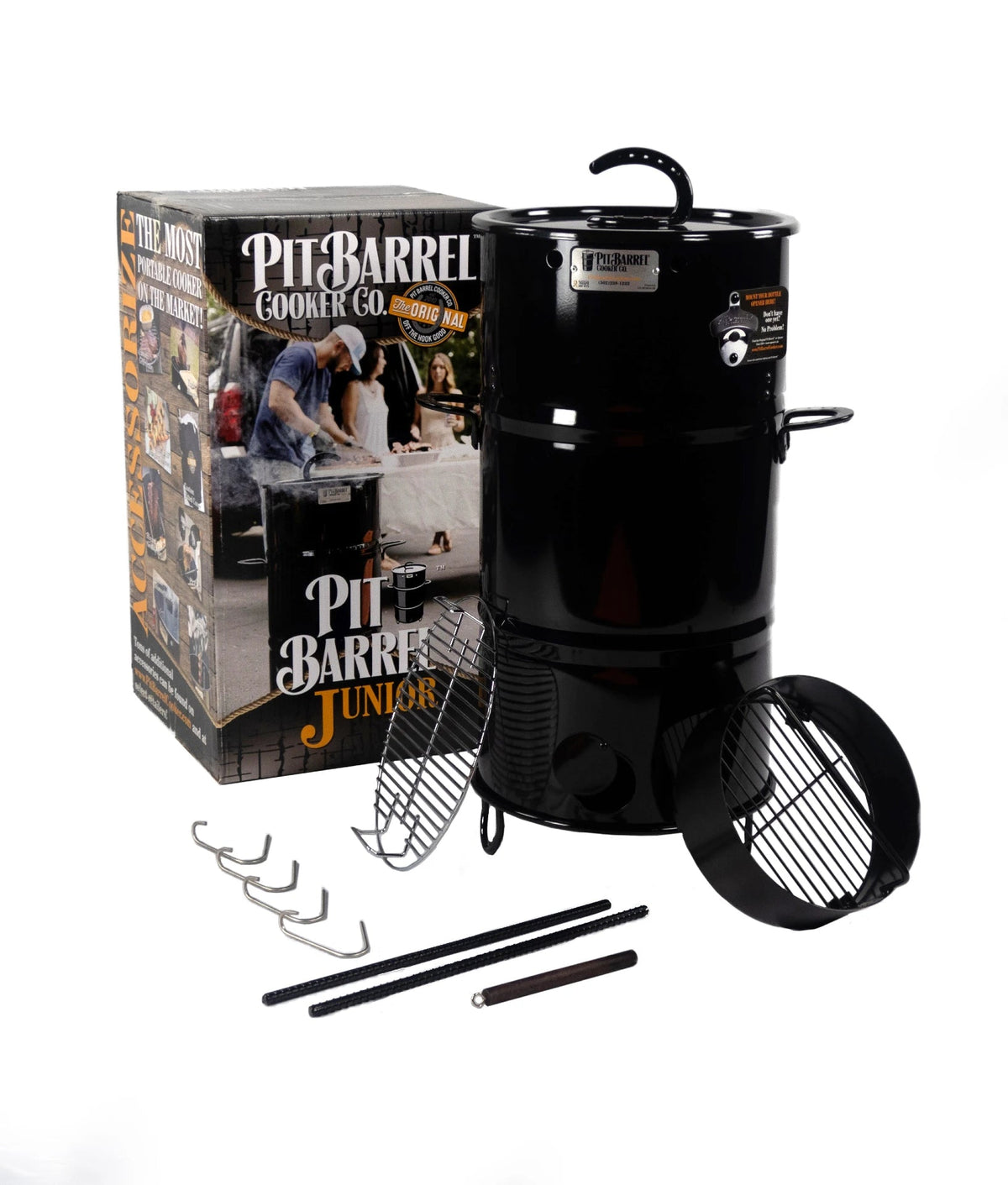 Black Pit Barrel Junior Grill with accessories for outdoor cooking