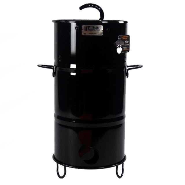 Black Pit Barrel Junior Grill with accessories for outdoor cooking