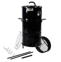 Black Pit Barrel Junior Grill with accessories for outdoor cooking