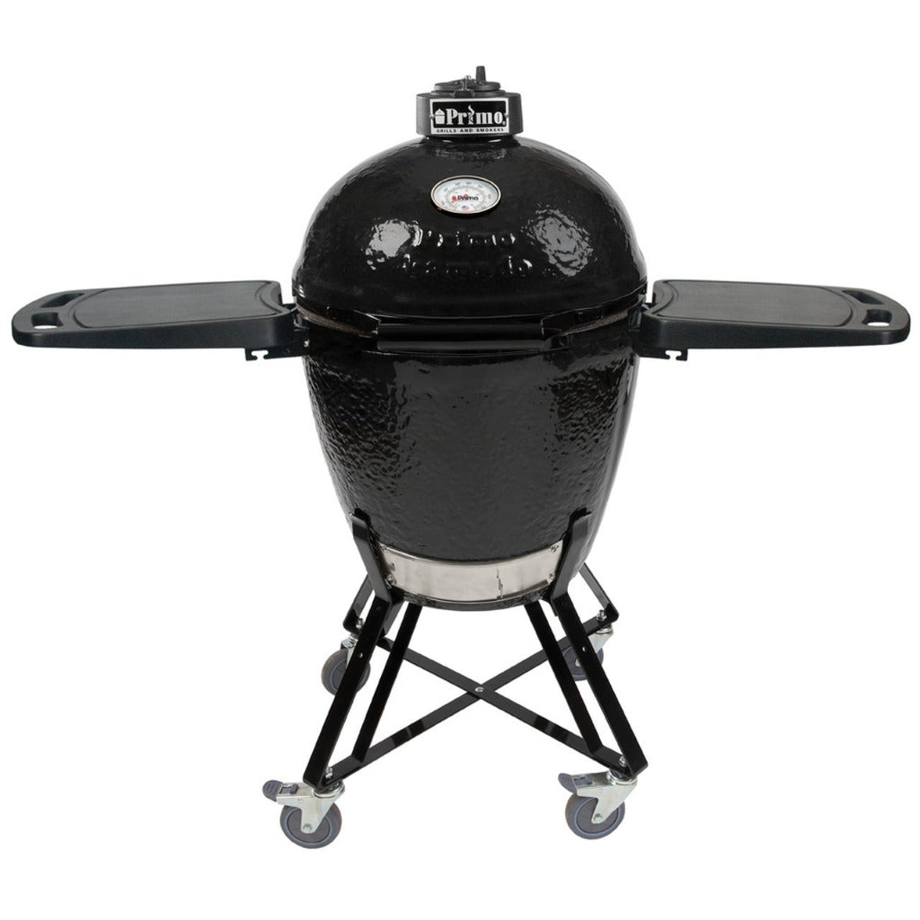 Primo Kamado Round Ceramic BBQ Grill on wheeled stand with foldable side shelves, ideal for outdoor cooking versatility and mobility.