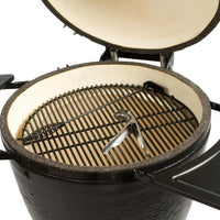 Interior view of Primo Kamado BBQ Grill showing ceramic firebox, stainless steel grates, and included grilling tools for premium cooking.