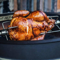 Finished rotisserie chicken with crispy skin cooked on BBQ