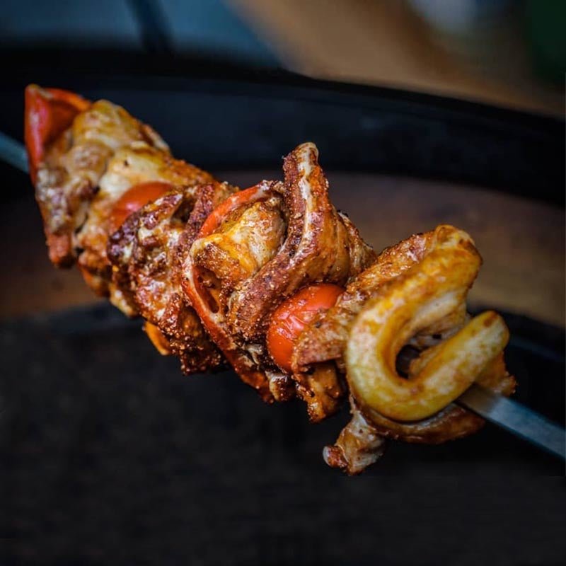 Grilled skewers with seasoned meat cooked using Primo Rotisserie Kit