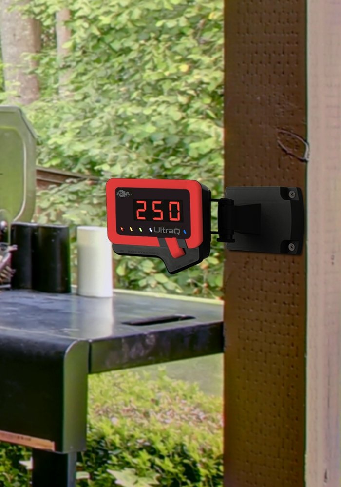 UltraQ BBQ temperature controller mounted outdoors near grill, showing 250°F, ideal for backyard grilling with app connectivity.